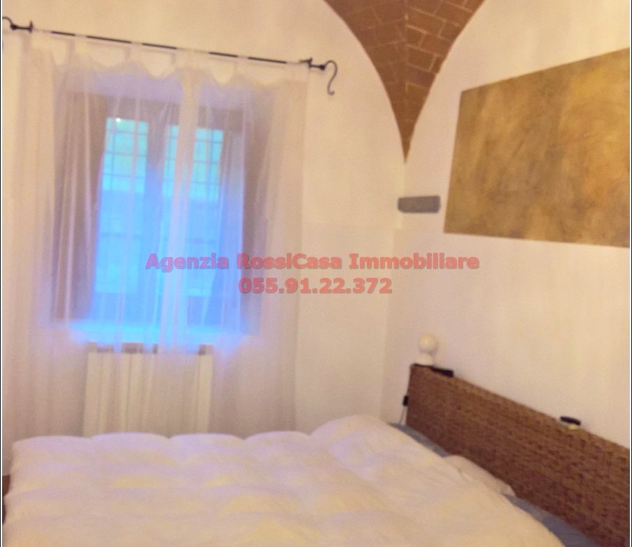 gourgeous appartment with vaulted ceilings and exposed bricks